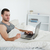 Young man purchasing online in his bedroom stock photo © wavebreak_media