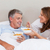 Mature couple having breakfast in their bed stock photo © wavebreak_media