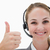 Smiling call center agent giving thumb up against a white background stock photo © wavebreak_media