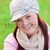 Joyful young woman wearing cap and scarf talking on phone on the grass stock photo © wavebreak_media