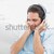 Handsome man listening to music against a white background stock photo © wavebreak_media