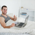 Happy man purchasing online with thumb up in his bedroom stock photo © wavebreak_media
