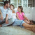 Happy family sitting on the rug in living room stock photo © wavebreak_media