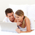 Affectionate couple using a laptop stock photo © wavebreak_media
