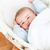 Cute baby boy waking-up lying in his cradle at home stock photo © wavebreak_media