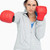 Brown haired woman in sweatshirt boxing against white background stock photo © wavebreak_media