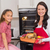 Happy mother and daughter posing with roast turkey stock photo © wavebreak_media