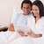 Young couple sitting on the bed using tablet pc stock photo © wavebreak_media