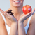 Close-up of woman showing chocolate and apple focus on chocolate and apple  stock photo © wavebreak_media