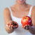 Blonde woman showing chocolate and apple focus on chocolate and apple  stock photo © wavebreak_media