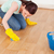Pretty red-haired woman cleaning the floor while kneeling at home stock photo © wavebreak_media