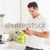 Handsome man having breakfast in his kitchen stock photo © wavebreak_media