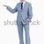 Portrait of a businessman pointing up against white background stock photo © wavebreak_media