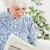 starszych · koncentruje · kobieta · czytania · gazety · sofa - zdjęcia stock © wavebreak_media