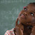 Schoolgirl sitting against chalkboard stock photo © wavebreak_media