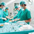 Side view of a surgical team operating a patient in an operation theatre stock photo © wavebreak_media