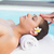 Tranquil brunette getting a head massage poolside stock photo © wavebreak_media