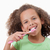 Cute girl brushing her teeth against a white background stock photo © wavebreak_media