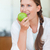 Portrait of a cute woman eating an apple in her kitchen stock photo © wavebreak_media