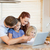 Family together with laptop in the kitchen stock photo © wavebreak_media