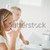 Doctor auscultating the mouth of a child in an examination room stock photo © wavebreak_media