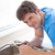 Confident man repairing his sink in the kitchen at home stock photo © wavebreak_media