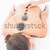 Pretty brunette enjoying a hot stone massage stock photo © wavebreak_media