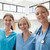 Three happy nurses at hospital stairwell stock photo © wavebreak_media