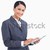 Close up of smiling saleswoman with arms folded against a white background stock photo © wavebreak_media