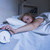 Woman in bed extending hand to alarm clock stock photo © wavebreak_media