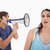 Man yelling at her girlfriend through a megaphone against a white background stock photo © wavebreak_media