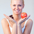Friendly woman holding chocolate and apple focus on woman  stock photo © wavebreak_media