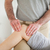 Male Chiropractor massaging a charming woman's knee in a room stock photo © wavebreak_media