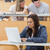 Student using laptop to take notes in lecture hall stock photo © wavebreak_media