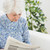 starszych · wesoły · kobieta · czytania · gazety · sofa - zdjęcia stock © wavebreak_media