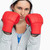 Brunette in sweatshirt wearing boxing gloves against white background stock photo © wavebreak_media