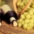 Red and white wine bottles and bunch of grapes stock photo © Yaruta