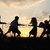 sziluett · csoport · boldog · gyerekek · játszik · legelő - stock fotó © zurijeta