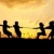 silhouet · groep · gelukkig · kinderen · spelen · weide - stockfoto © zurijeta