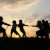 silhouet · groep · gelukkig · kinderen · spelen · weide - stockfoto © zurijeta